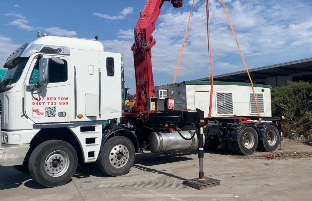 Crane Loading Two 6×3 m Portable Buildings