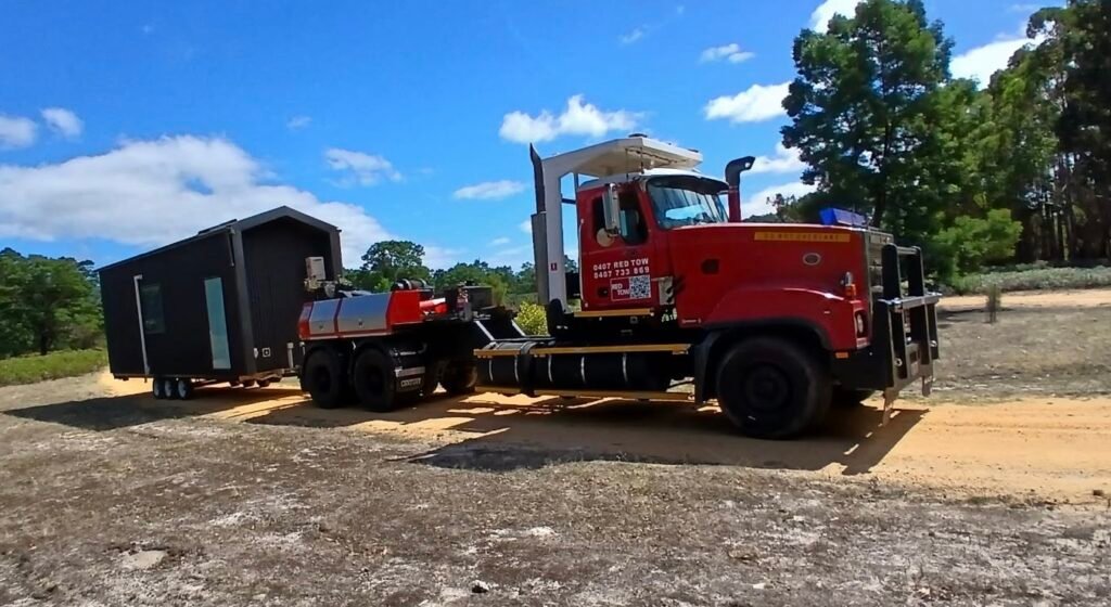 Tiny home towed by our T1 T2 Rated Titan Tow Truck